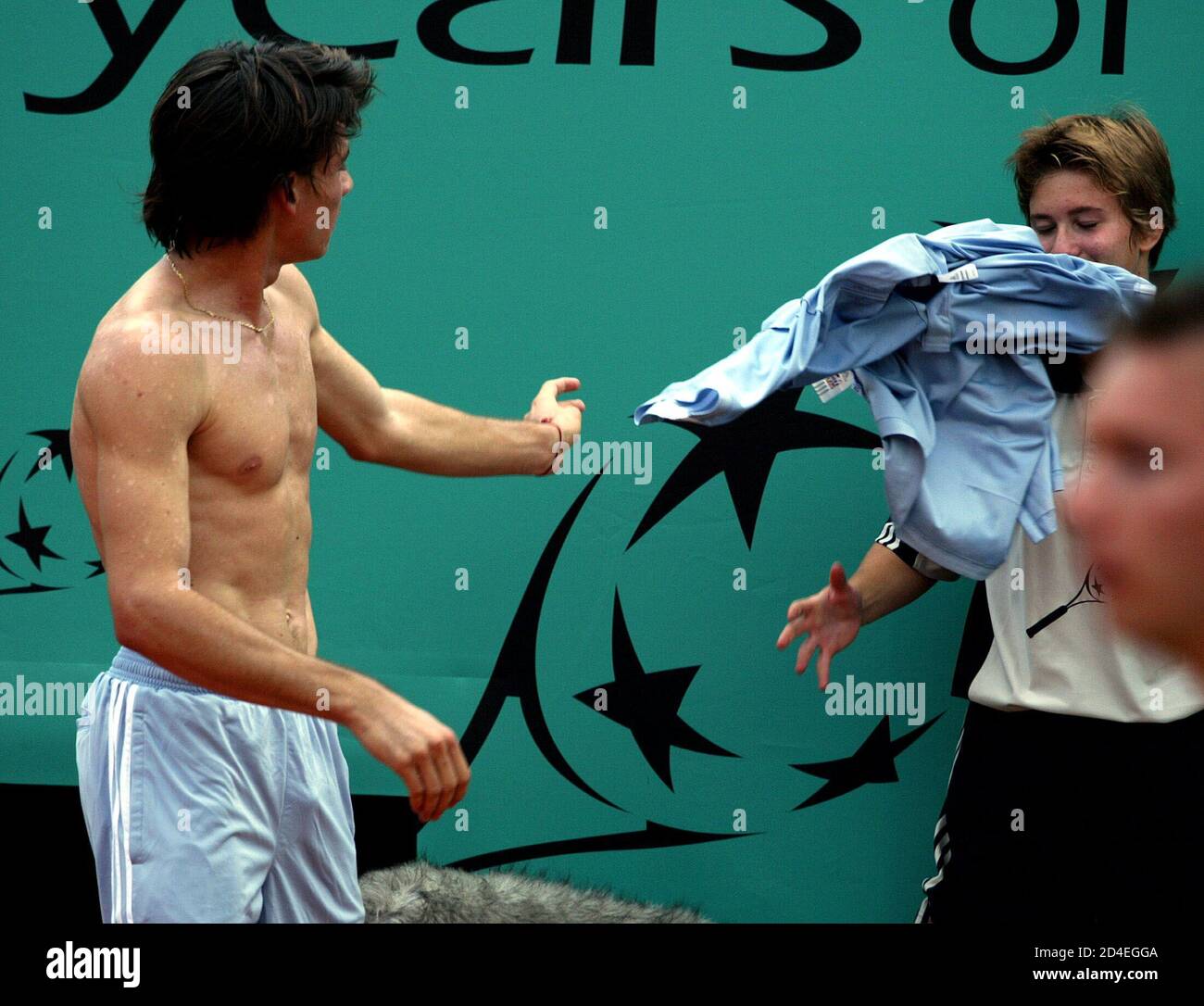 Guillermo Coria Of Argentina Gives His Shirt To Ballgirl During His Match Against Martin Verkerk Of The Netherlands In The Semi Final Of The French Open Stock Photo Alamy