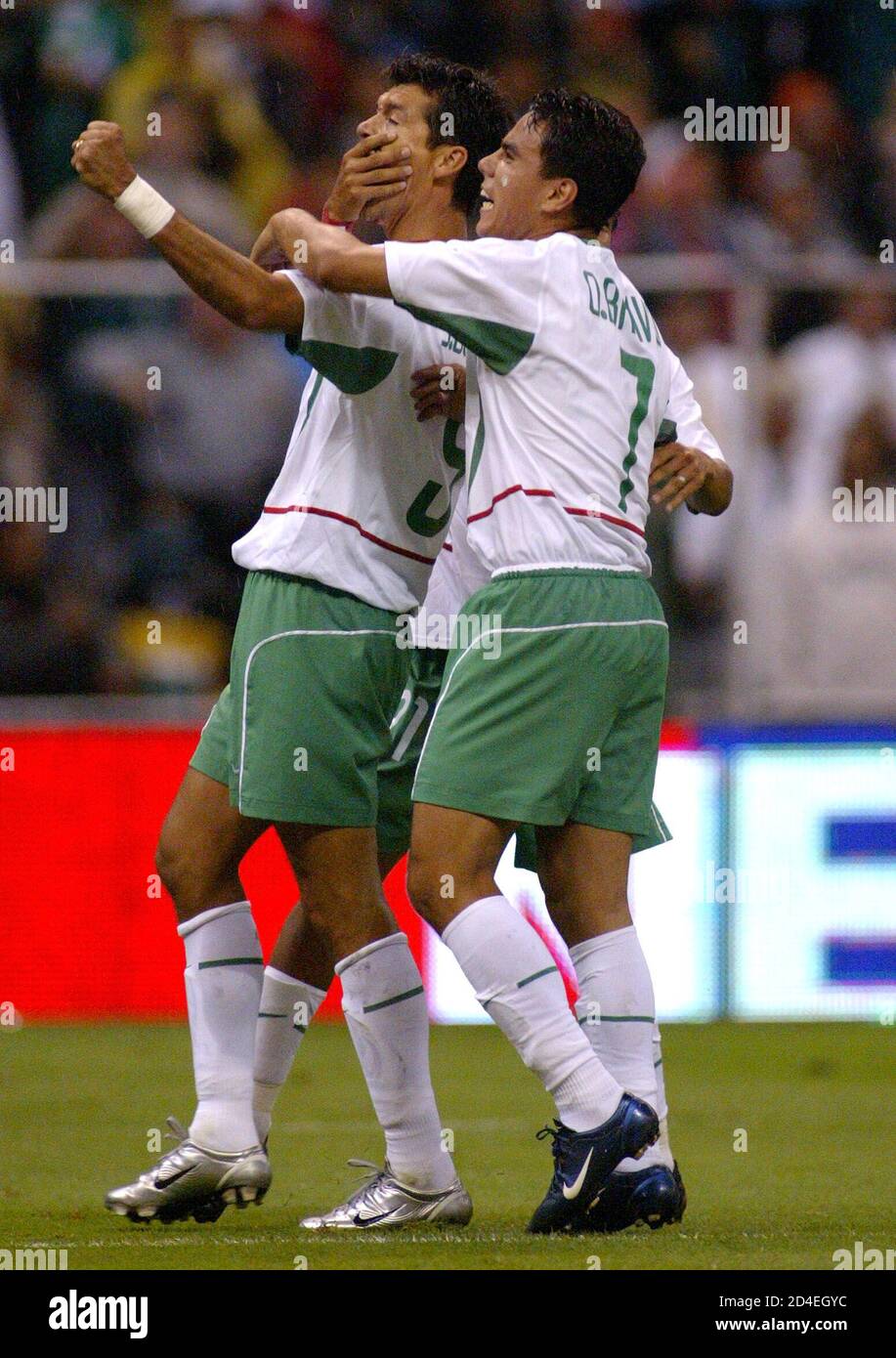 Mexico's striker Jared Borgetti (L) celebrates his first goal with teammate  Omar Bravo(7) against Costa Rica during the first half of their 2003  Confederation of North, Central American and Caribbean Association Football  (