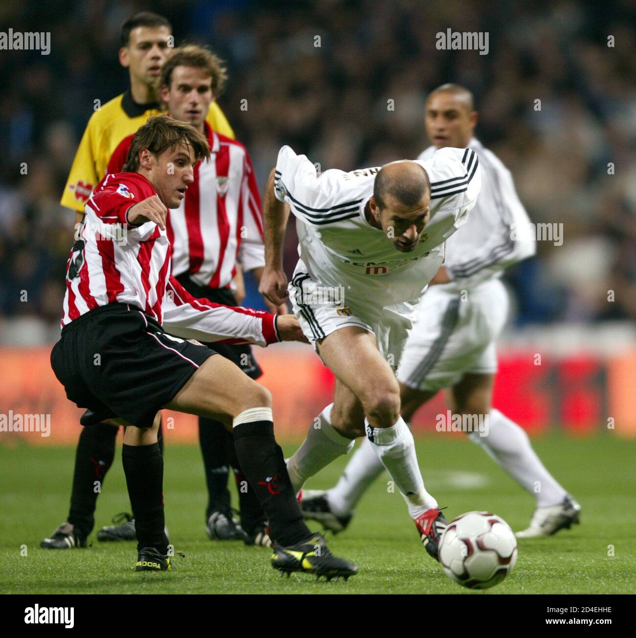 Real Madrid S Zinedine Zidane Escapes From Athletic Bilbao Players Jonan Garcia And Tiko During Their Spanish First Division Match In Madrid Stock Photo Alamy