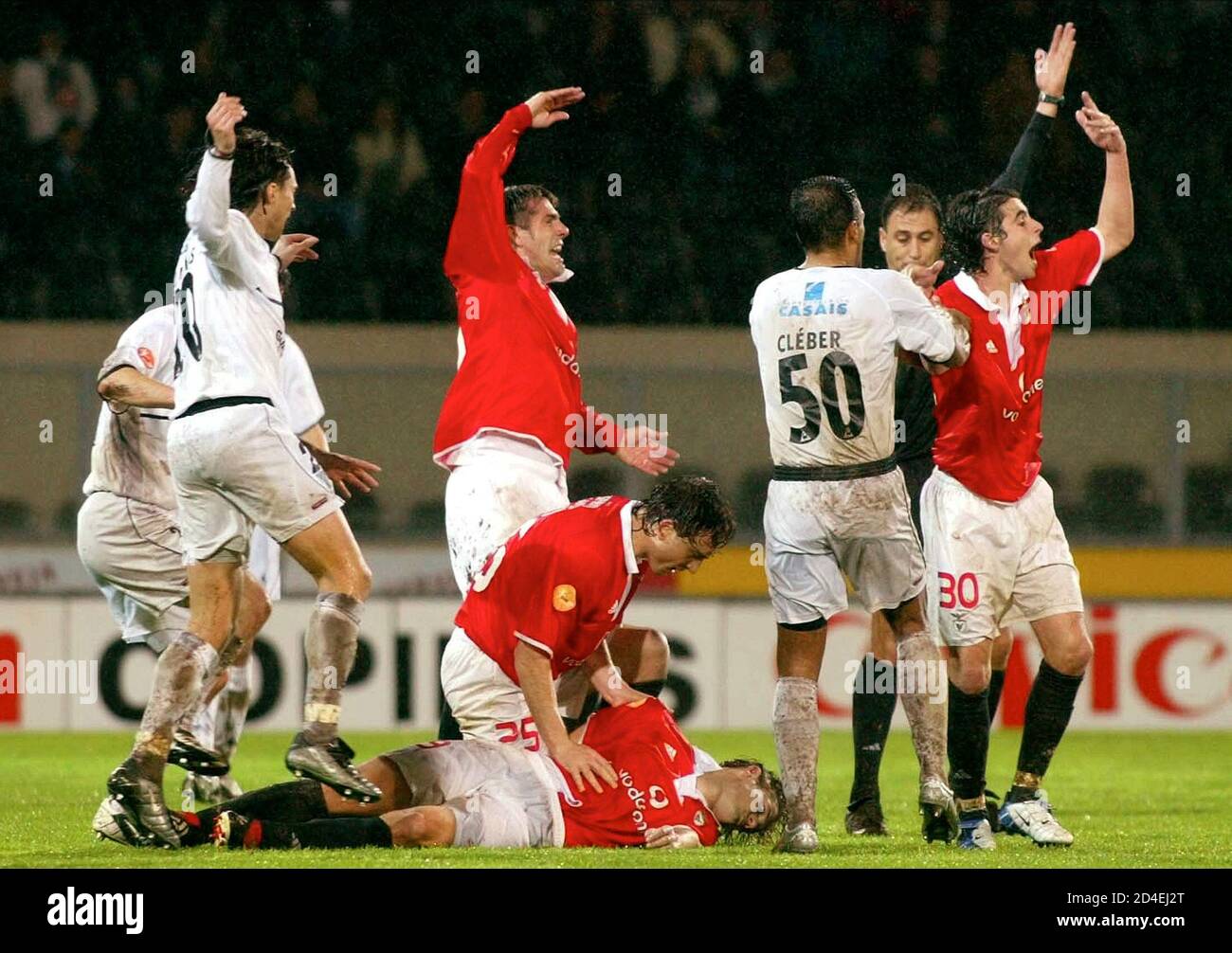 Players Wave Asking For Help For Benfica S Hungarian Soccer Striker Miklos Feher Ground During The Portuguese Premier League Match Held At The Guimaraes Stadium January 25 2004 Feher Died On Sunday After [ 1006 x 1300 Pixel ]