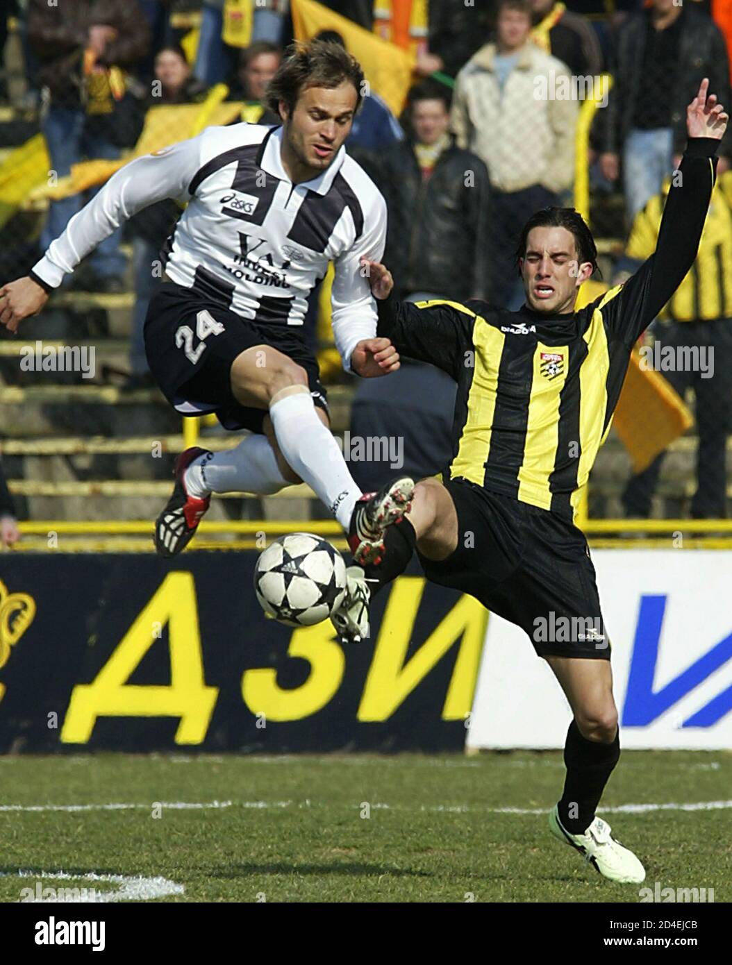 Robert Petrov (L) from Lokomotiv Plovdiv is challenged by Georgi Andonov  (R) from Botev Plovdiv during their Bulgarian championship match in the  town of Plovdiv, some 130km east from the capital Sofia