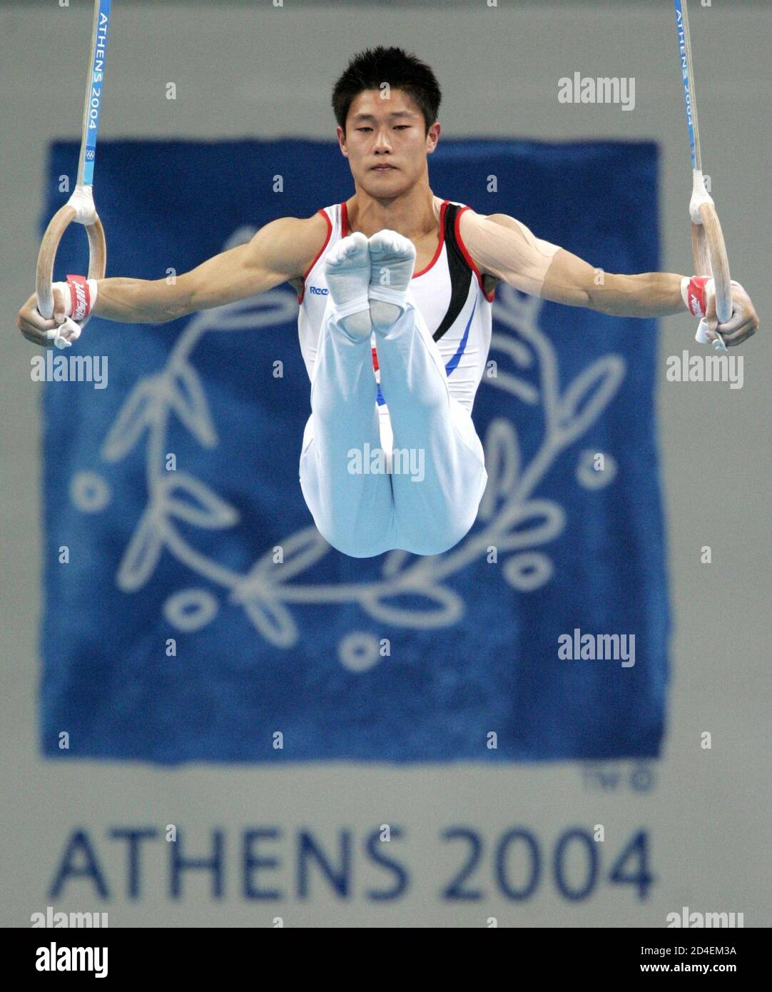 South Korea's Kim Dae-eun performs a routine on the rings during the men's  artistic gymnastics individual all-round final at the Athens 2004 Olympic  Games August 18, 2004. Paul Hamm of the U.S.