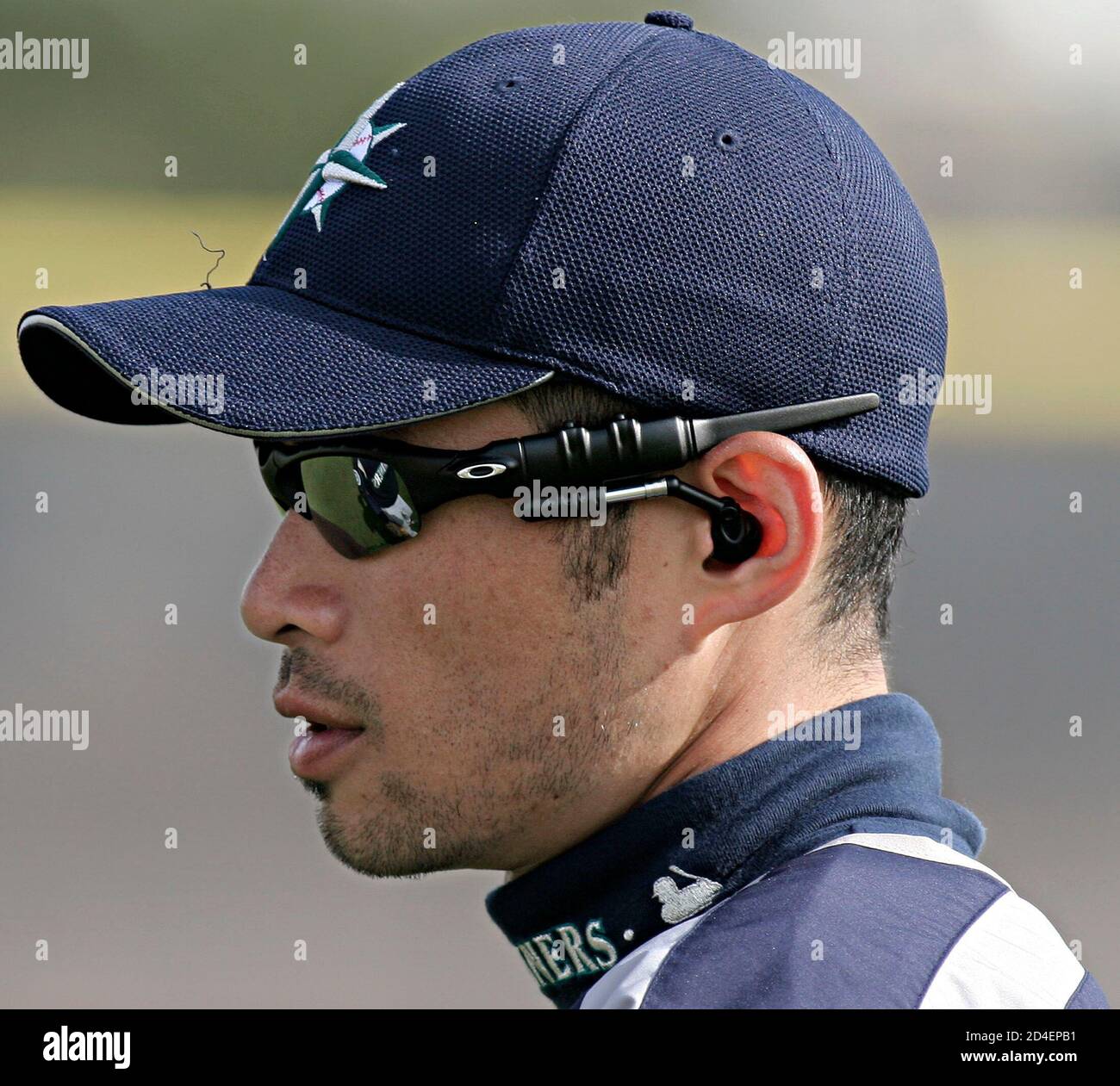 Seattle Mariners outfielder Ichiro Suzuki wears a pair of Oakley Thump  sunglasses that feature an MP3 music player, at the team's spring training  camp in Peoria, Arizona, March 4, 2005. The glasses