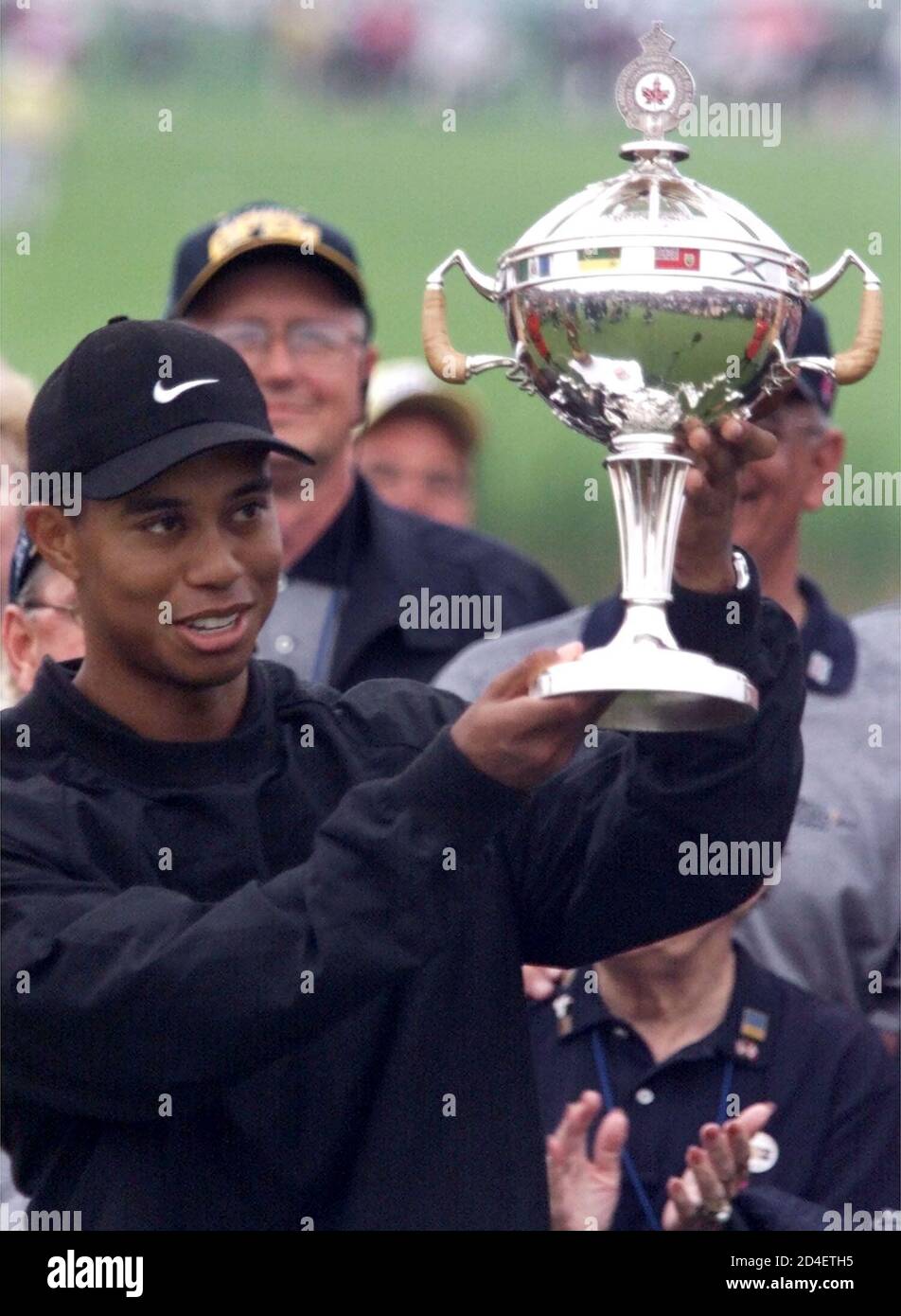 Tiger Woods Hoists The Bell Canadian Open Trophy After Winning The Pga Event In Oakville Ontario September 10 2000 With His Third International Victory This Season Woods Joins Lee Trevino Who In
