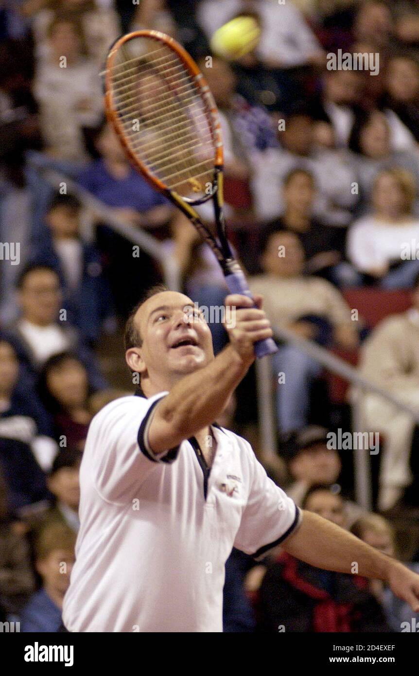 Amazon.com founder Jeff Bezos hits a return shot during a pro-am match  against Microsoft founder Bill Gates and Andre Agassi at the Schick Xtreme  III Tennis Challenge, October 7, 2001 at Key