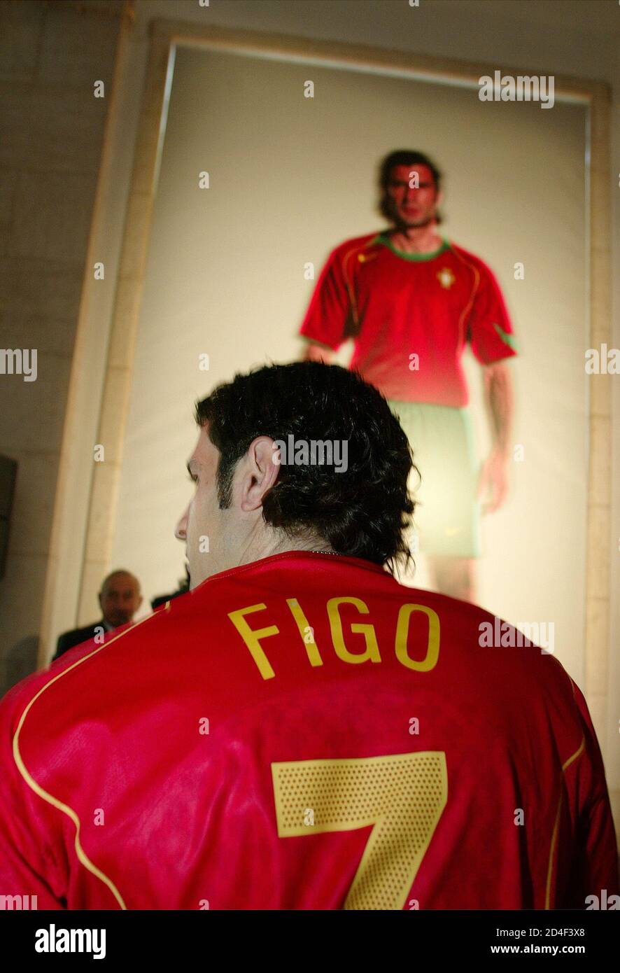 Portuguese Soccer player Luis Figo shows journalists the new national  soccer team jersey during the presentation of the new designer team jersey  at the Nacional stadium in Lisbon February 16, 2004. REUTERS/Nacho