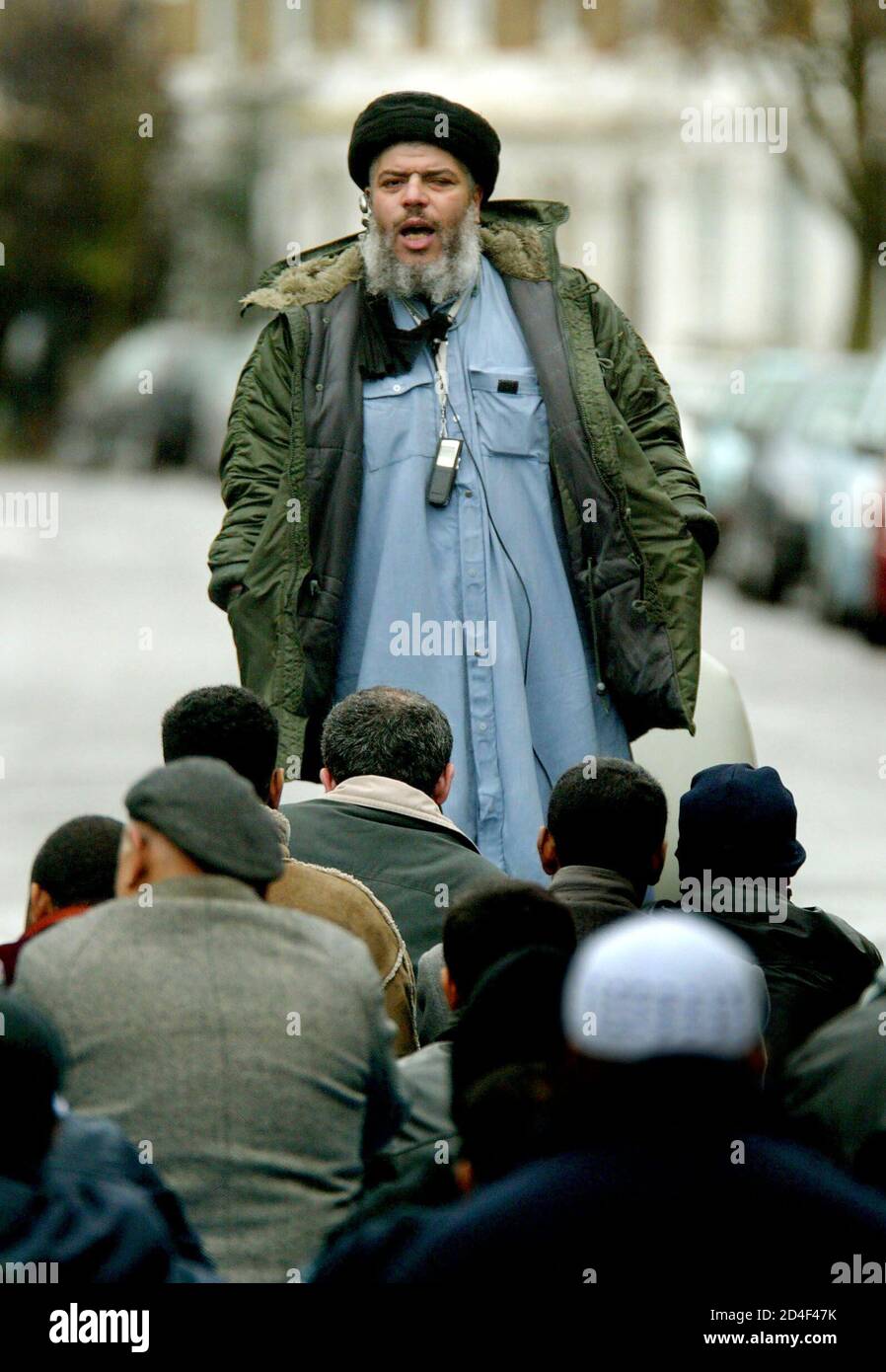 Muslim cleric Sheikh Abu Hamza al-Masri leads prayers outside North London  Central Mosque in Finsbury Park, London, March 19, 2004. Hamza, who was  suspended by the Charity Commission from preaching inside the