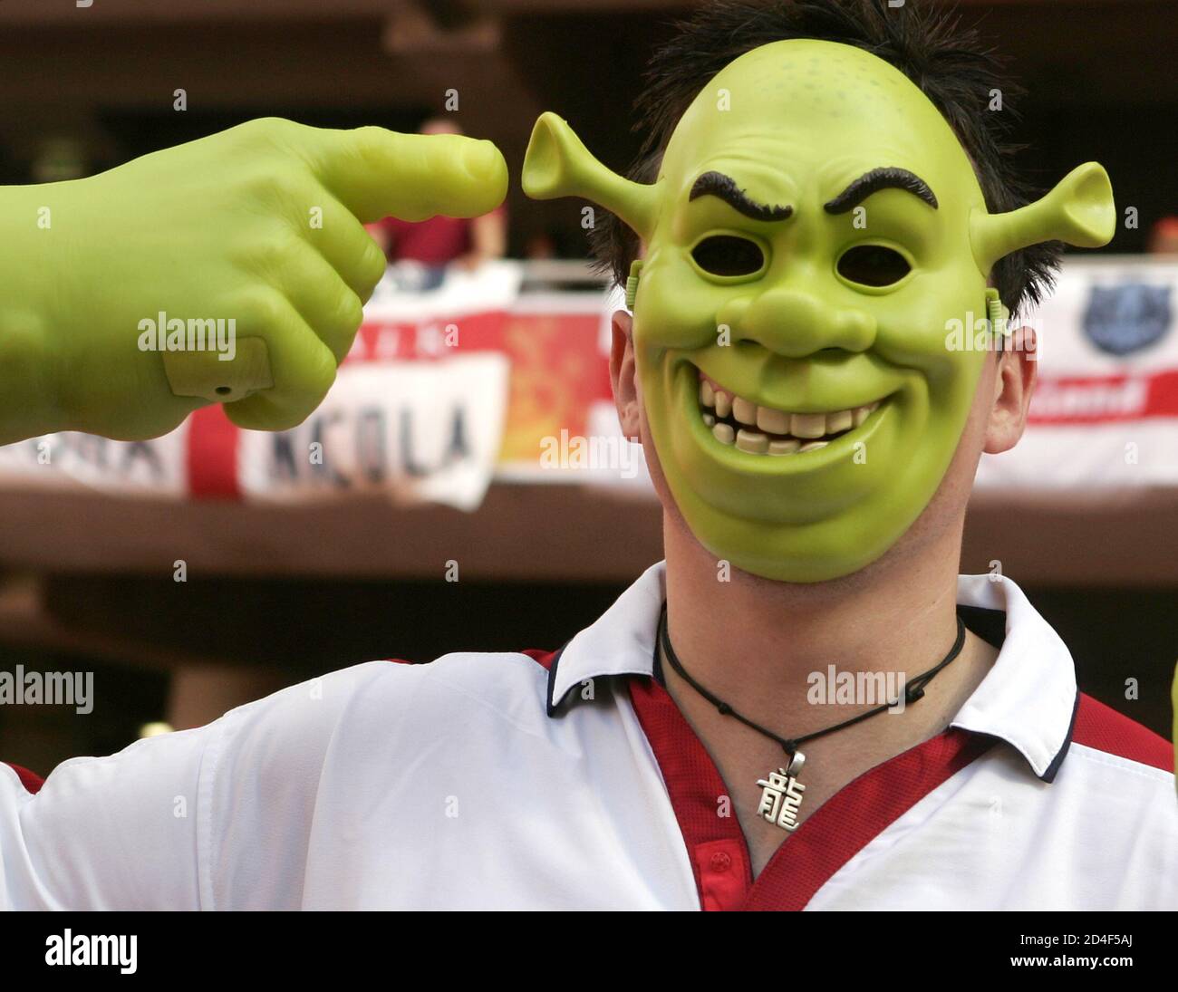 An England Supporter With Shrek Mask A Reference To England Player Wayne Rooney Cheers Ahead Of Their Euro 2004 Quarter Final Soccer Match Against Portugal At The Luz Stadium In Lisbon