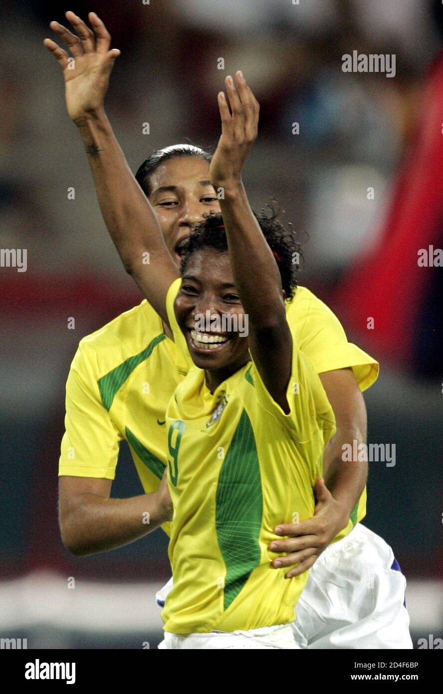 Brazil's Daniela (R) celebrates with her team mate Miraildes Formiga after  scoring against Uruguay during their Pan American games soccer match in Rio  de Janeiro July 12, 2007. REUTERS/Bruno Domingos (BRAZIL Stock
