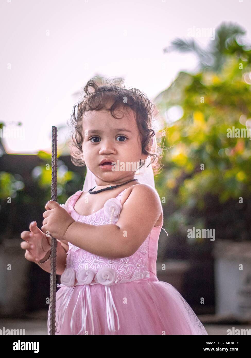 Cute Girl wearing pink fairytale dress stock image. Stock Photo
