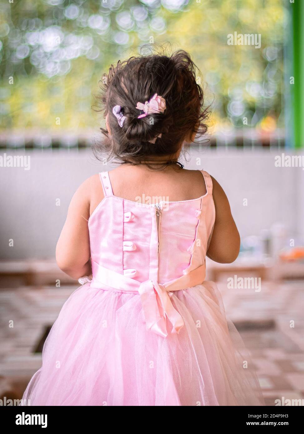 Cute Girl wearing pink fairytale dress stock image. Stock Photo