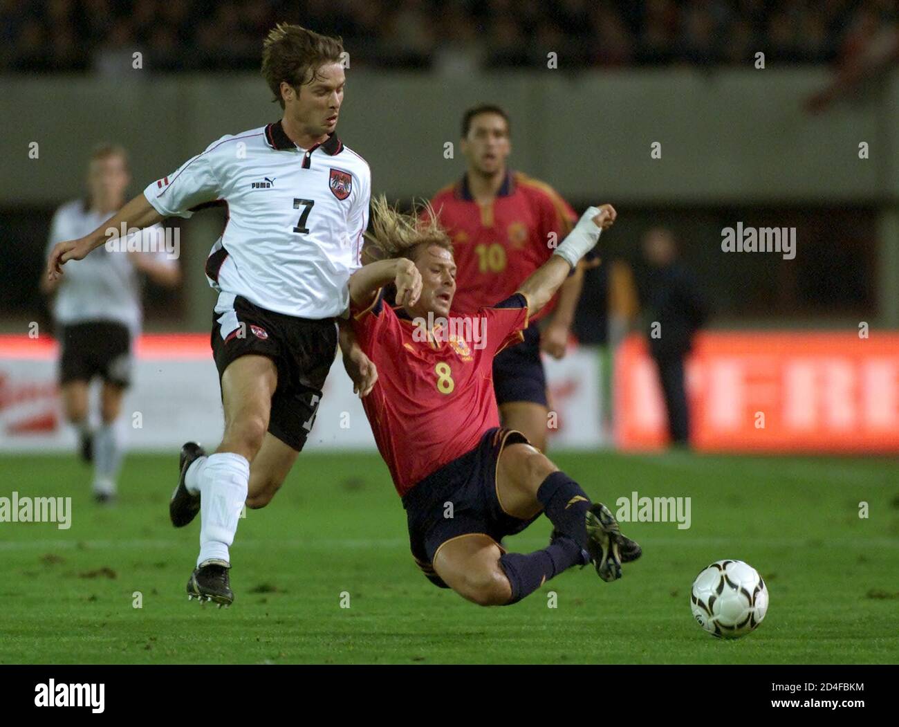 Austria's Harald Cerny (L) and Gaizka Mendieta (R) from Spain fight for the ball as Raul Gonzalez looks on during their soccer World Cup European group seven qualifier in Vienna October 11, 2000.  LF/CRB Stock Photo