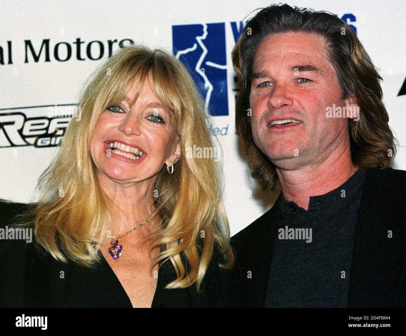 Actors Goldie Hawn (L) and Kurt Russell (R) pose for photographers at