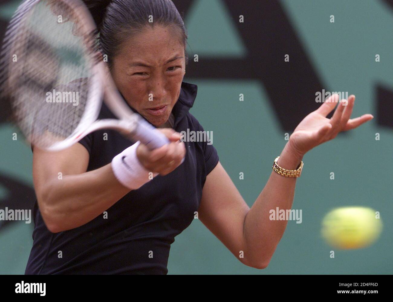 Marion Bartoli of France returns a forehand to Ai Sugiyama of Japan during  their match at the French tennis open at Roland Garros stadium in Paris May  28, 2002. REUTERS/Vincent Kessler VK/CRB