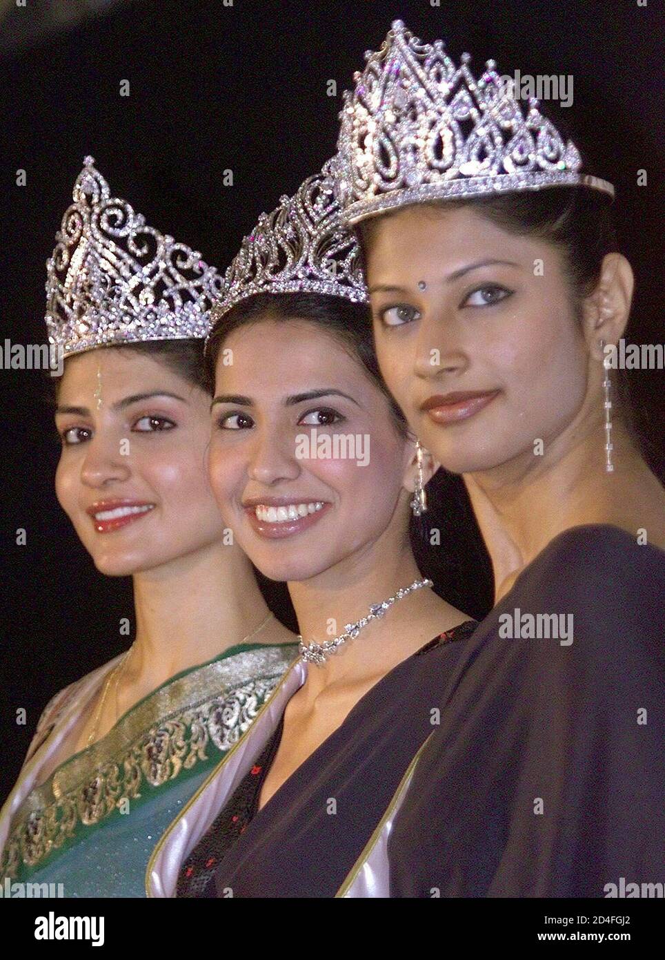 From Left Miss India World 2003 Ami Vashi Miss India Universe Nikita Anand And Miss India Earth Shweta Vijay Pose For Photographers During A News Conference In New Delhi February 4 2003