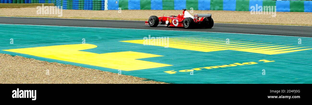 German Ferrari Driver Michael Schumacher Drives Past An F1 Logo During Free Practice For The French Formula One Grand Prix In Magny Cours July 5 03 Schumacher Is Hoping To Become The First German Ferrari Driver Michael Schumacher Drives Past An F1 Logo During Free Practice For The French Formula One Grand Prix In Magny Cours July 5 03 Schumacher Is Hoping To Become The First