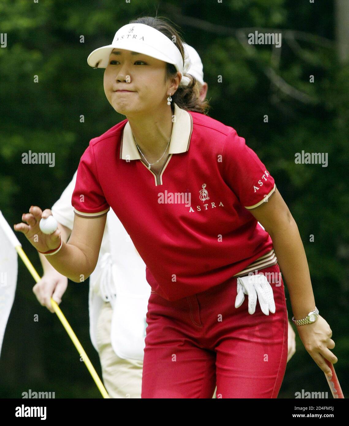 Golfer Soo-Yun Kang reacts as she retrieves her ball after putting for par  on the eighth hole during the second round of the Sybase Big Apple Classic  in New Rochelle, New York,
