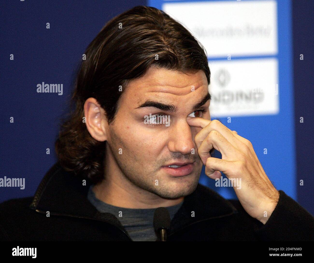 World number one Roger Federer of Switzerland gestures as he announces his  withdrawal from the Davidoff Swiss Indoors tennis tournament in Basel.  World number one Roger Federer of Switzerland gestures as he
