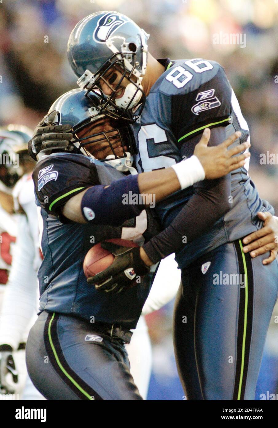 Seattle Seahawks tight end Jeremy Stevens (86) celebrates with teammate Shaun Alexander (L) after his touchdown catch in the third quarter against the Atlanata Falcons. Seattle went on to beat the Falcons 28-26 to win their first NFC West division title. REUTERS/Robert Sorbo  RSS Stock Photo