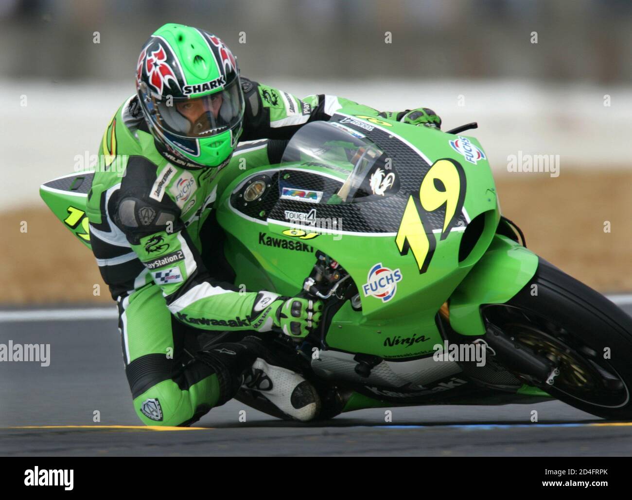 rider Olivier Jacque of France rides his Kawasaki during a free practice MotoGP motorcycling French Grand Prix at the Le Mans circuit in the west of France May 14,