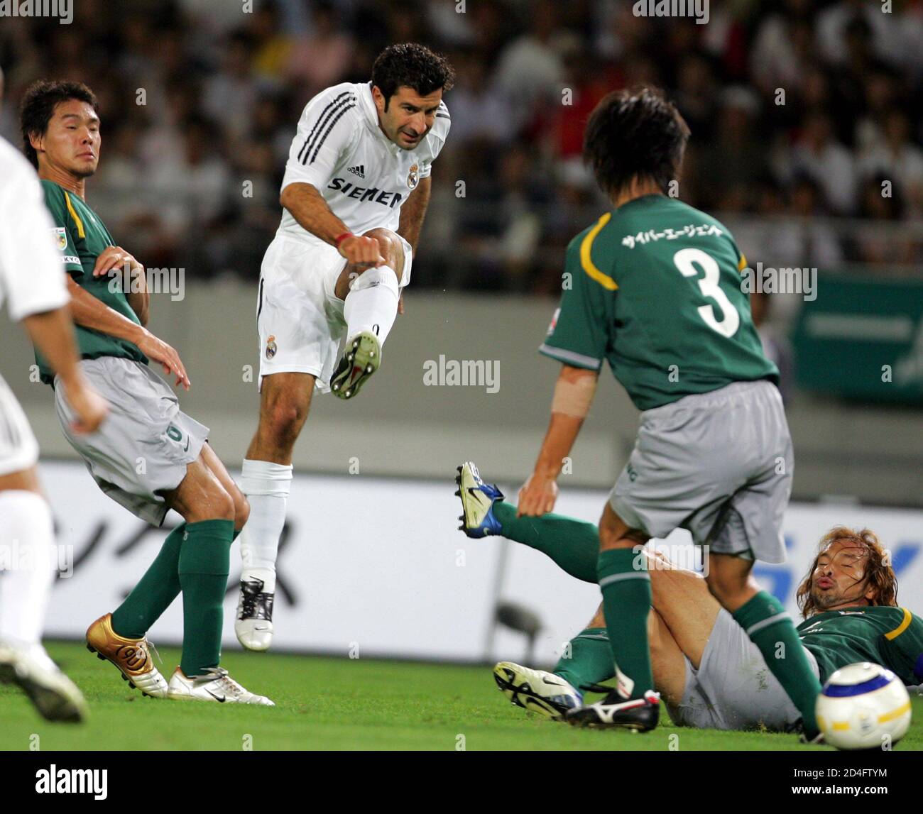 Real Madrid S Figo The Ball As Tokyo Verdy S Players Try To Block In Their International Friendly Match In Tokyo Real Madrid S Midfielder Luis Figo 2nd L Kicks The Ball As Tokyo Verdy S Real Madrid S Figo The Ball As Tokyo Verdy S Players Try To Block In Their International Friendly Match In Tokyo Real Madrid S Midfielder Luis Figo 2nd L Kicks The Ball As Tokyo Verdy S