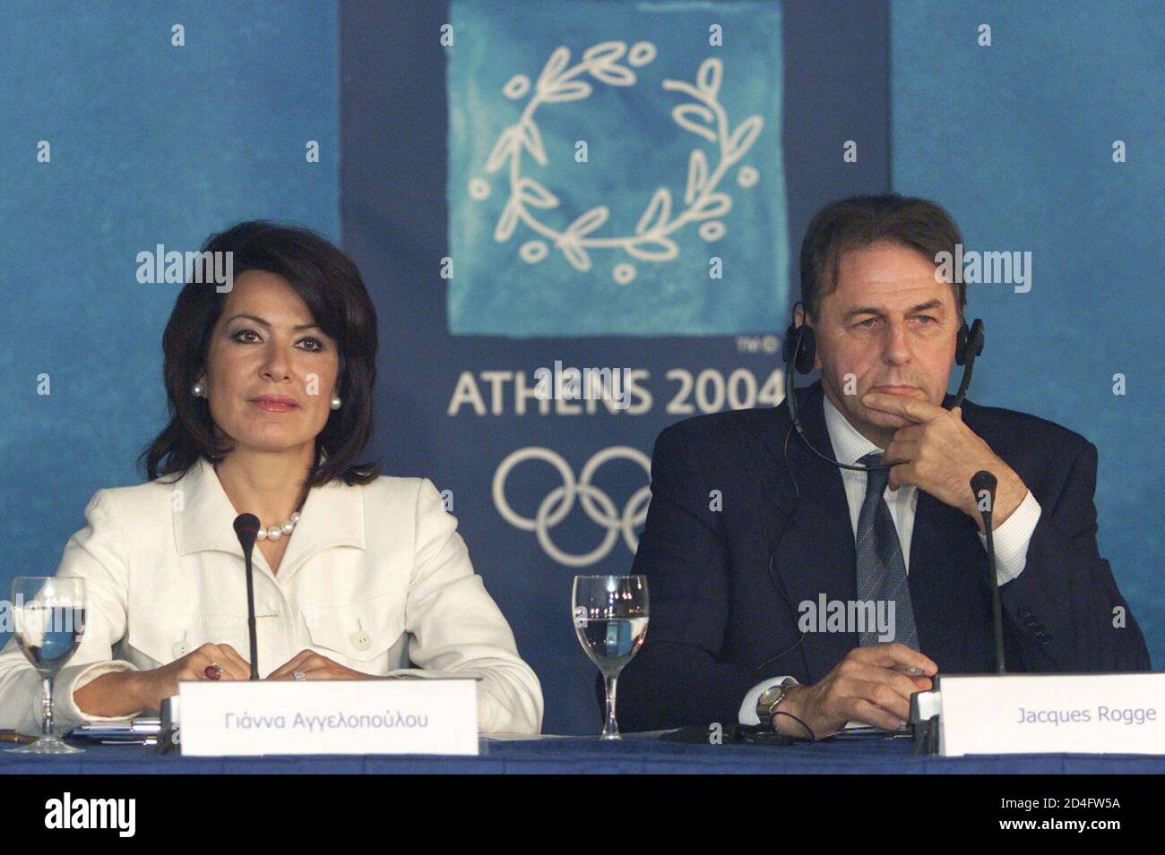 President Of The Ioc Coordinating Commission Jacques Rogge R And President Of The Greek Organising Committee For The 2004 Olympic Games Yianna Angelopoulou Listen To Reporters During A News Conference In Athens