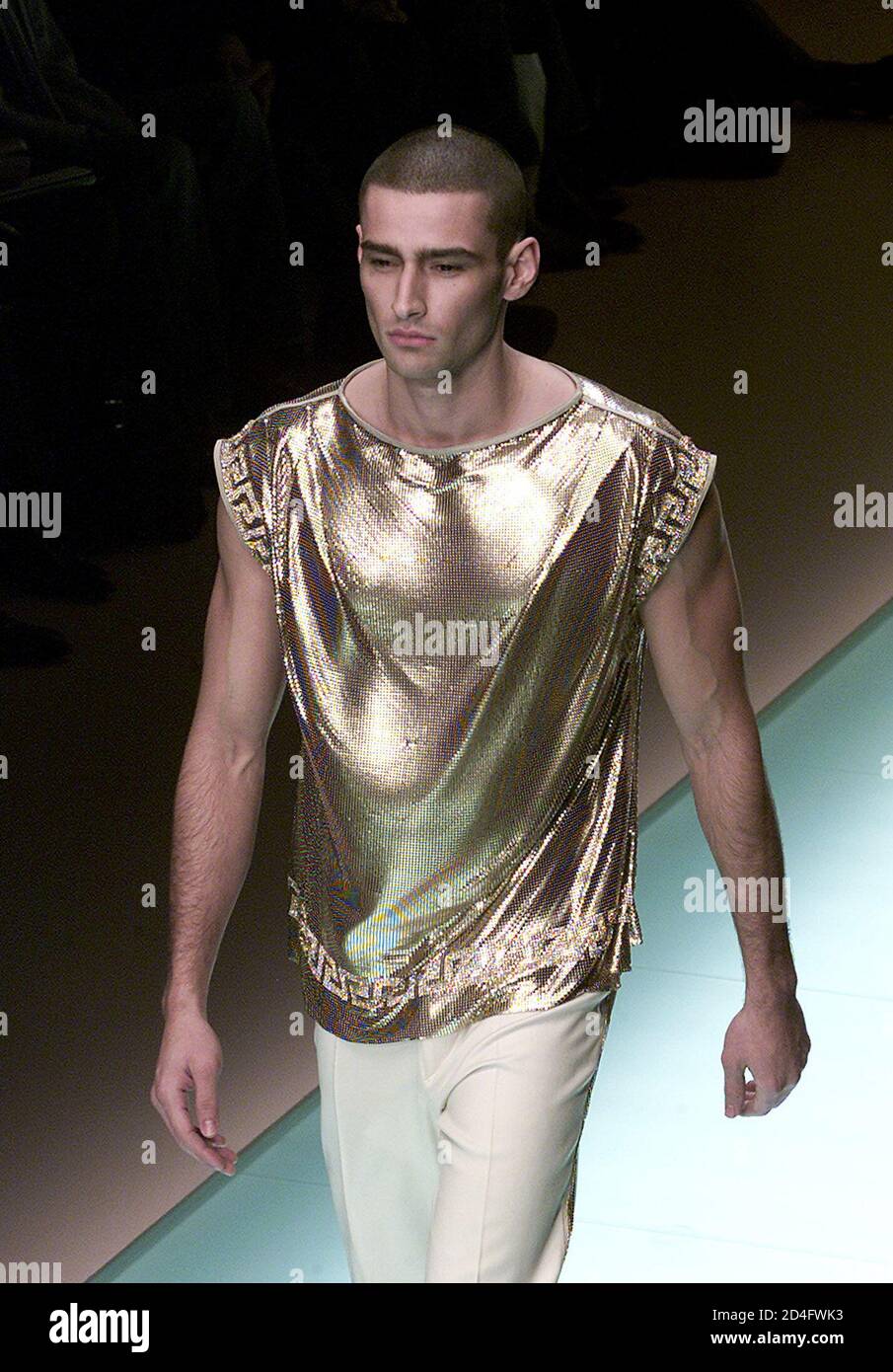 A model wears a short-sleeves shirt as part of Gianni Versace Autumn/Winter  ready-to-