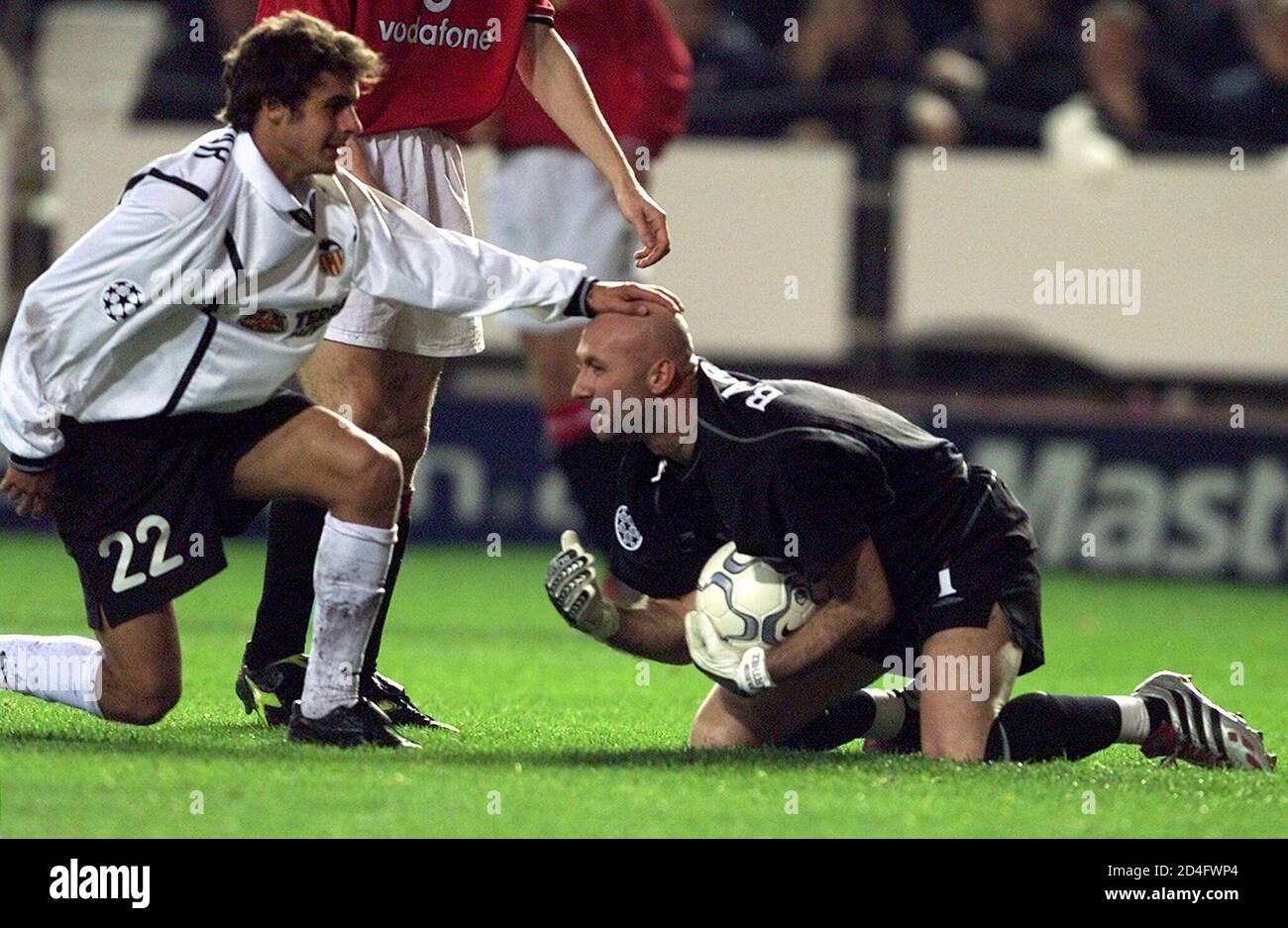 Manchester United S French Goalkeeper Fabien Barthez R Is Patted On The Head By Valencia S Argentine Pablo Aimar L As He Gets Up Following A Shot At Goal During Their Champions Leage Group