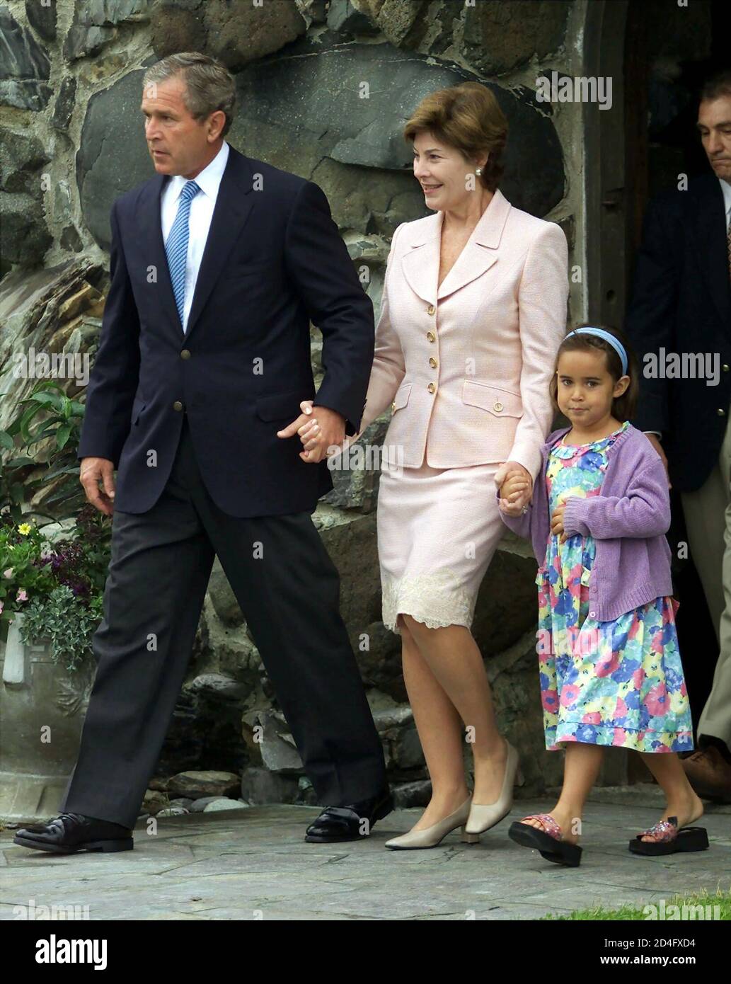 U.S. President George W. Bush and first lady Laura Bush leave church with their young niece Gigi Koch, daughter of the president's sister Dorothy, after attending Sunday services at St. Ann's Episcopal Church July 8, 2001 in Kennebunkport, Maine. The president is in the final day of a four-day family vacation at his parents' seaside summer home.  JRB/ME Stock Photo