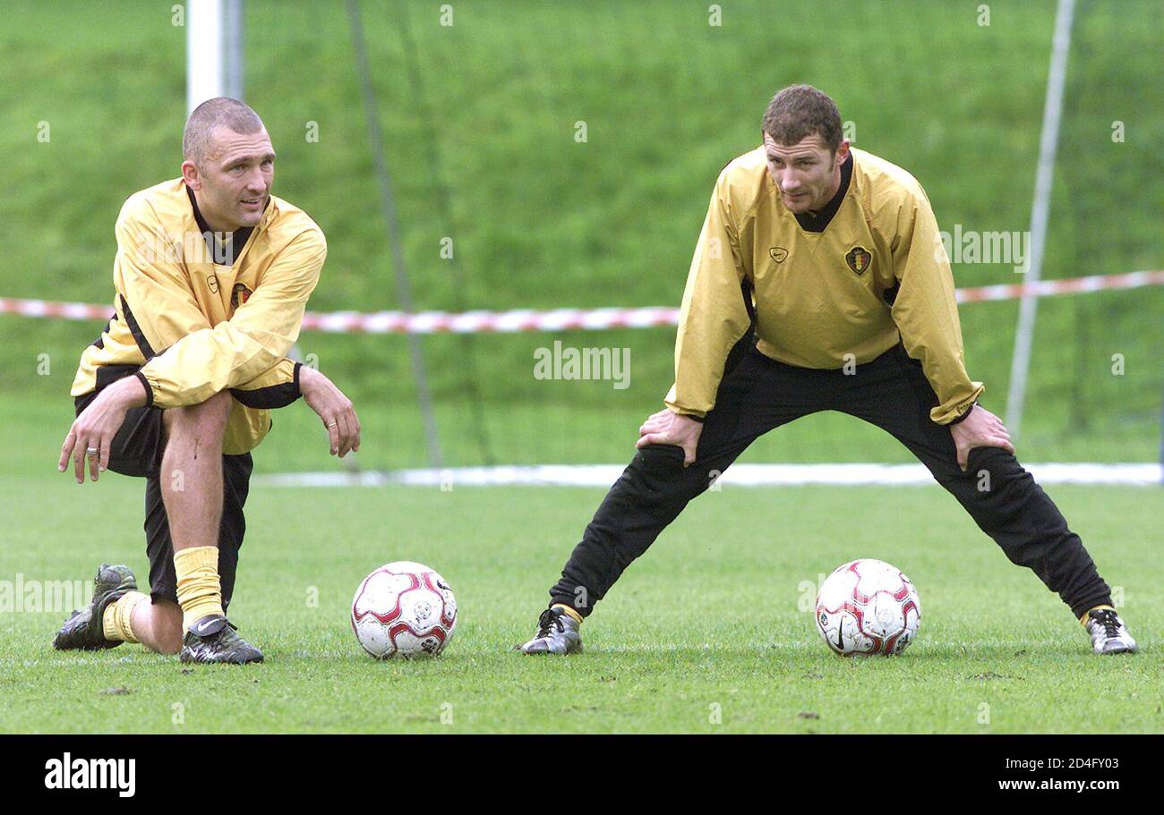 Belgian internationals Eric Van Meir (L) of Standard and Danny Boffin (R) of Sint-Truiden, stretch during the squad's training session in Kraainem, near Brussels, October 2, 2001. Belgium will play a World Cup qualifying match against Croatia in Zagreb on Saturday. REUTERS/Yves Herman  THR/ Stock Photo