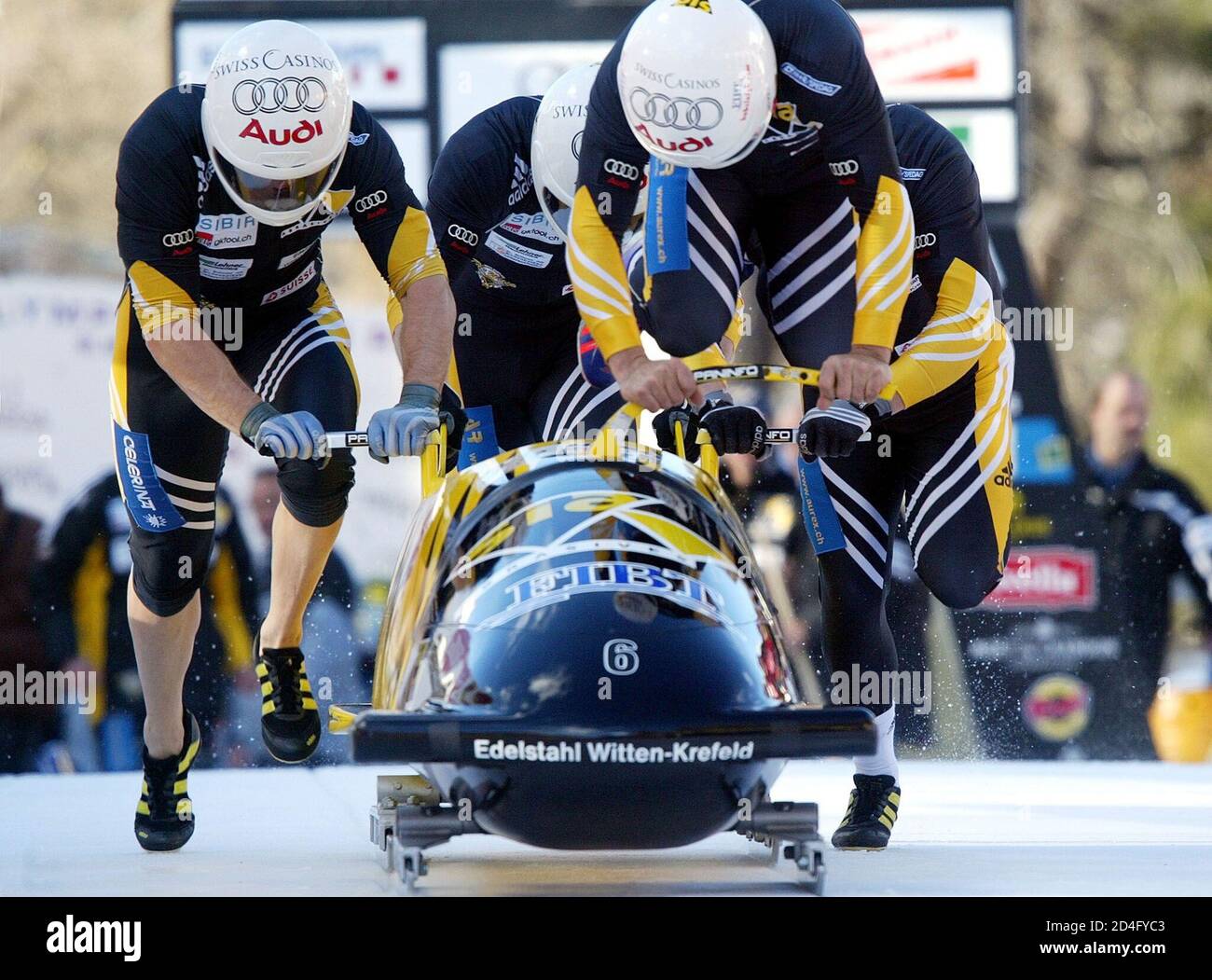 Swiss bob pilot Christian Reich (front) and his teammates Steve Anderhub,  Urs Aeberhard und Stefan Hammer enter the track on bob Switzerland 3 at a  four man bobsleigh World Cup race in
