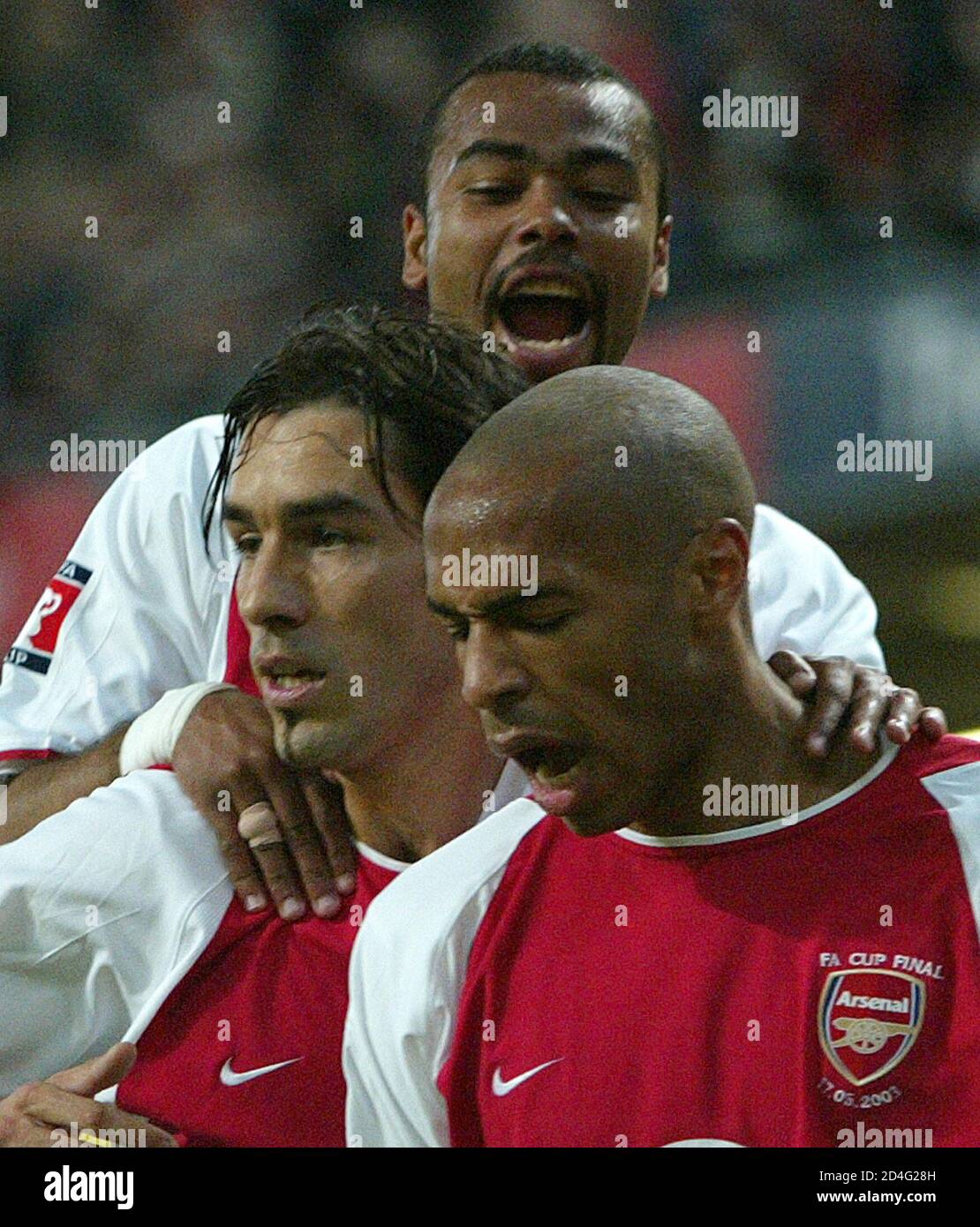 Arsenal's Robert Pires (L) celebrates his goal against Southampton with  team mates Ashley Cole (top) and Thierry Henry during the FA Cup final at  the Millennium Stadium in Cardiff May 17, 2003.