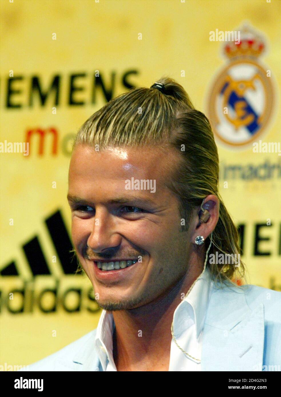 Real Madrid S New Signing England S David Beckham Smiles During The Ceremony To Present Him With His New Strip In Madrid July 2 2003 Real Madrid Paid 35 Million Euros For The Midfielder