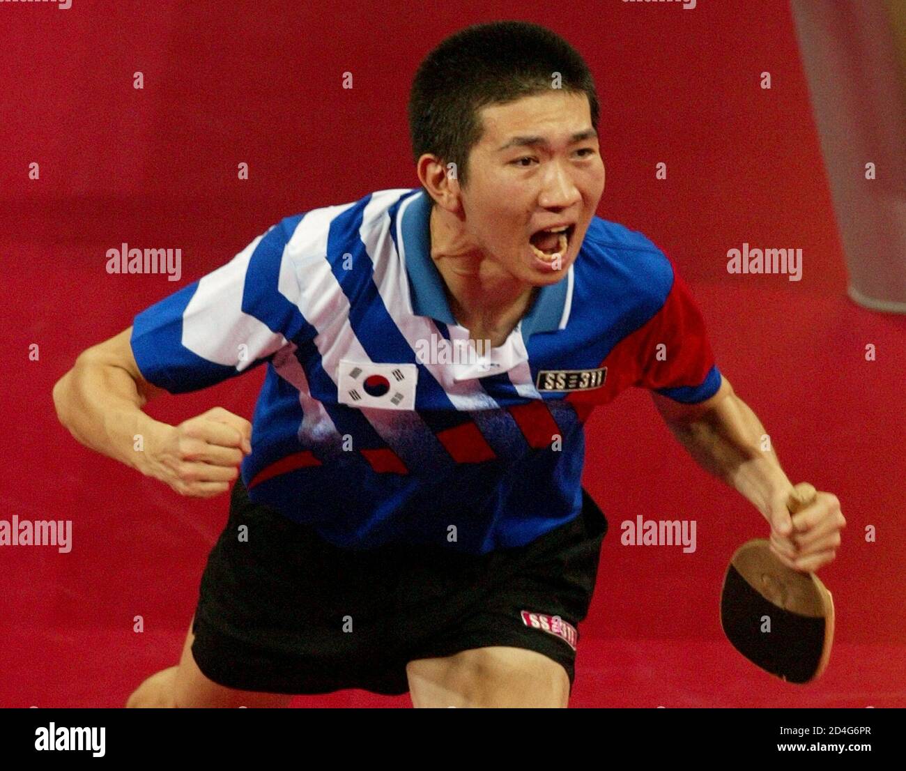 South Korea's gold medallist  Ryu Seung Min celebrates victory over [China's Wang Hao] at men's singles final Table tennis match at Athens 2004 Olympic Summer Games, August 23, 2004. [Ryu won the gold with a score of 4-2.] Stock Photo