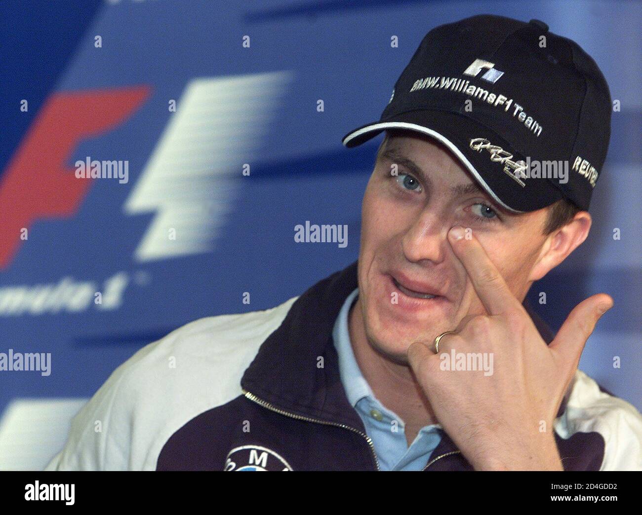 Germany's BMW Williams driver Ralf Schumacher wipes his eye at a news  conference ahead of the Belgian Formula One Grand Prix in Spa Francorchamps  August 30, 2001. [Ralf Schumacher, Scotland's McLaren Mercedes