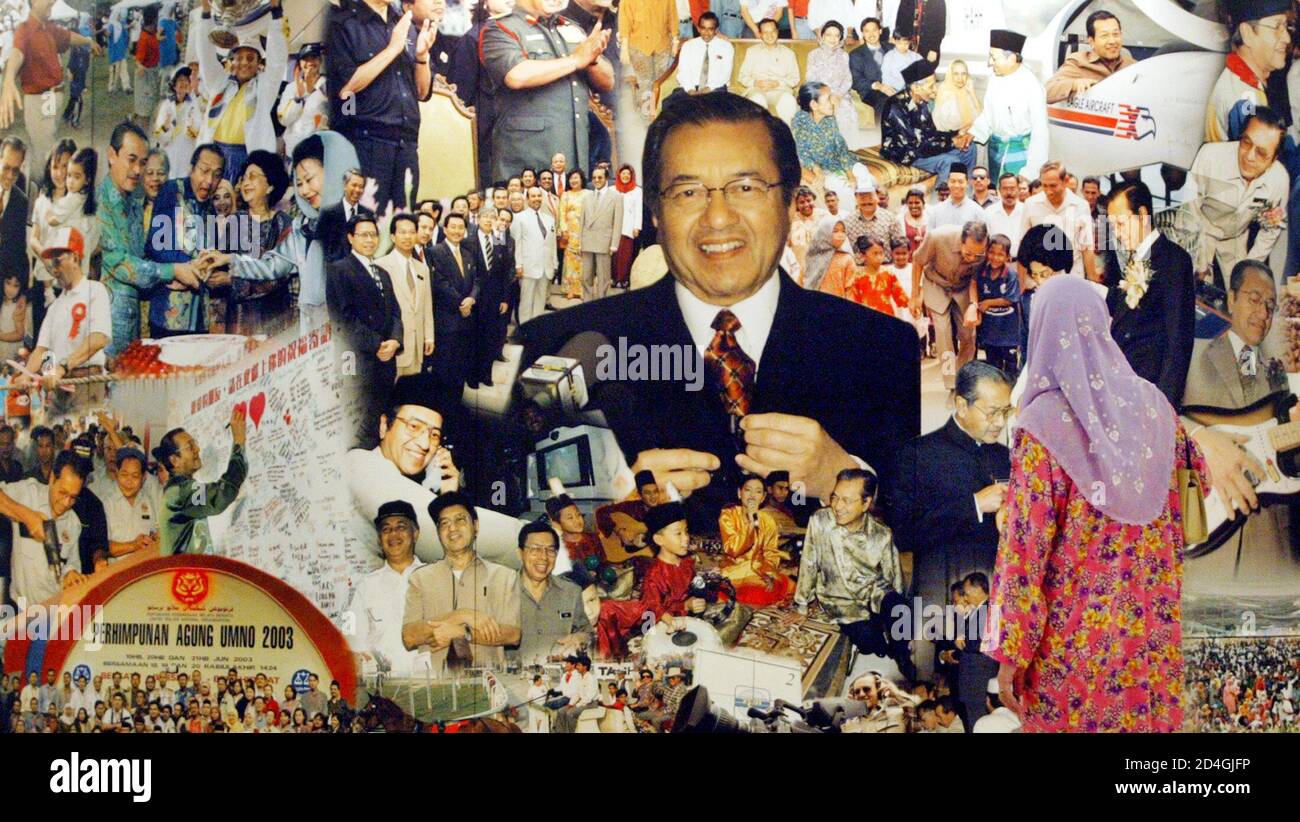 A Malaysian Looks At Images Of Prime Minister Mahathir Mohamad At National Art Gallery In Kuala Lumpur On October 7 2003 A Thousand Faces Of Dr Mahathir A Collection Of Pictures From