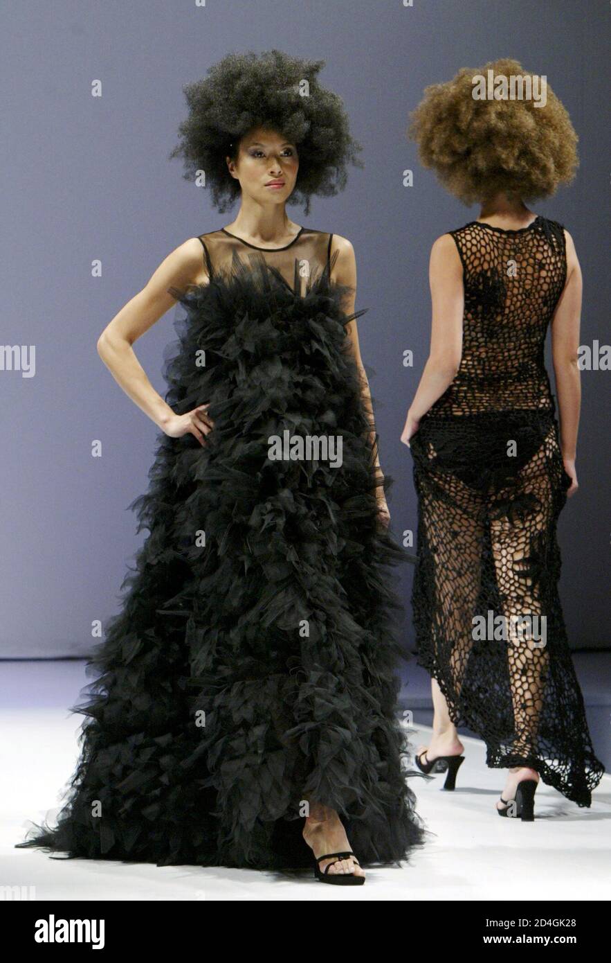 Models present creations by Hong Kong fashion designer William Tang at the Hong Kong Fashion Week Fall/Winter 2004 show in Hong Kong January 14, 2004. [Hong Kong Fashion Week and the fashion fair 'World Boutique' invited 190 exhibitors offering over 300 brand names and designers from Australia, Canada, Mainland China, France, Germany, India, Indonesia, Italy, Macau, Malaysia, Korea, Singapore, Taiwan, Thailand and United States.] Stock Photo