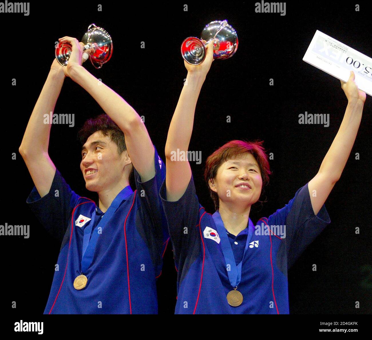 South Korea S Dong Moon Kim And Kyung Min Ra Celebrate Their Victory Over South Korea S Yong Hyun Kim And Hyo Jung Lee In The Final Of The Mixed Doubles South Korea S Dong Moon Kim L And Kyung Min