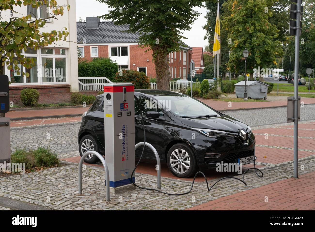 Small Electric car at charging point. Whittmund. East Frisia. Germany. October 2020 Stock Photo