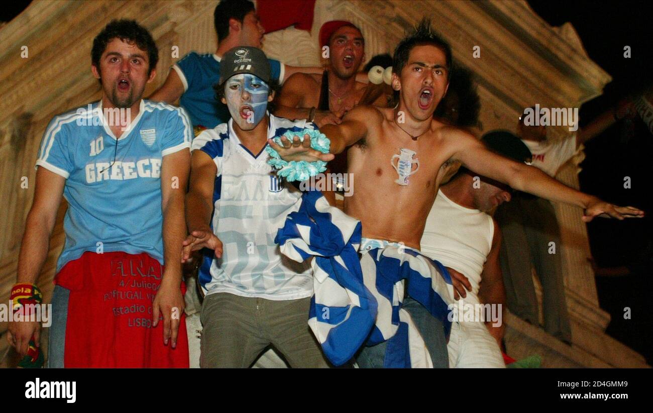 Greek supporters celebrate after the Euro 2004 final match against Portugal  in the centre of Lisbon, July 5, 2004. Greece won the game 1-0 to become  the European Champions 2004. REUTERS/Peter Andrews