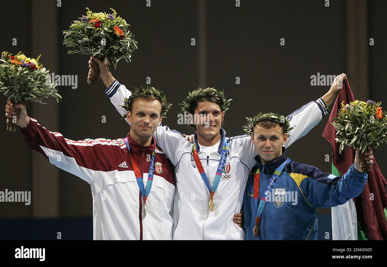 Italy S Olympic Gold Medallist Aldo Montano C Celebrates On The Podium With Hungary S Zsolt Nemcsik L Who Won Silver And Ukraine S Bronze Medallist Vladislav Tretiak R In The Men S Individual Sabre At