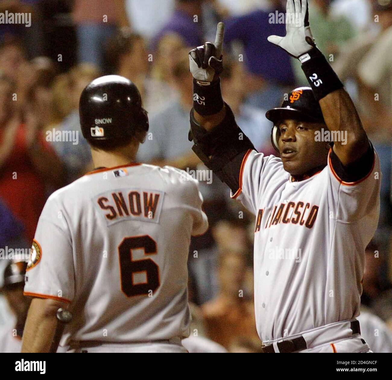 San Francisco Giants Barry Bonds R Is Welcomed By Giants J T Snow Following Bonds 698th Career Home Run Against The Colorado Rockies At Coors Field In Denver Colorado September 7 04 With