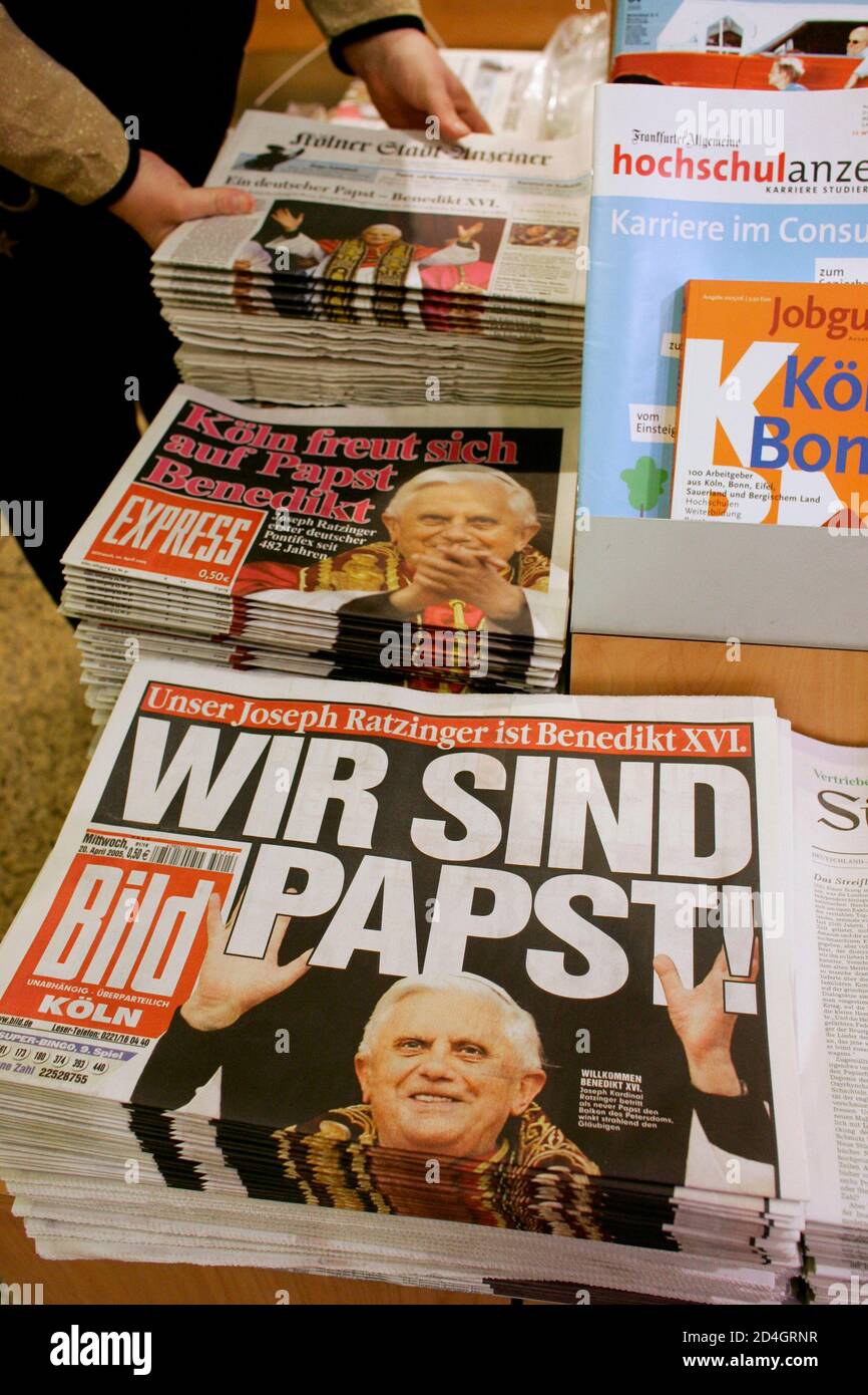 German newspapers with the front page showing the newly elected Pope Benedict XVI are stacked at a newspaper stand at Cologne's railway station April 20, 2005. Roman Catholic Cardinals have elected arch-conservative German cardinal Joseph Ratzinger as Pope, choosing a shy, elderly theologian to defend the stern legacy of his charismatic predecessor, [John Paul II. Ratzinger took the name Pope Benedict XVI after one of the quickest conclaves of the past century in a secretive ballot that delighted traditionalists in the 1.1 billion member Church but dismayed liberals who had longed for a more m Stock Photo