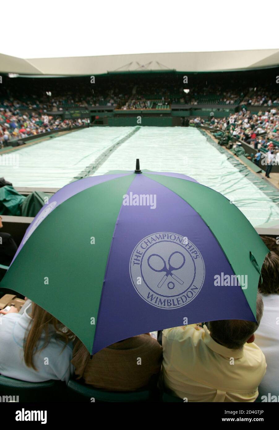 Spectators on centre court shelter hires stock photography and images