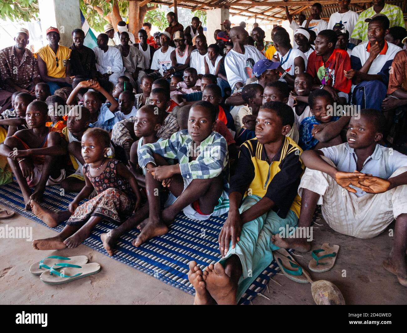 People of the village of Juffureh watching the Senegal versus Gambia game for the Africa Cup of Nations qualifier Stock Photo