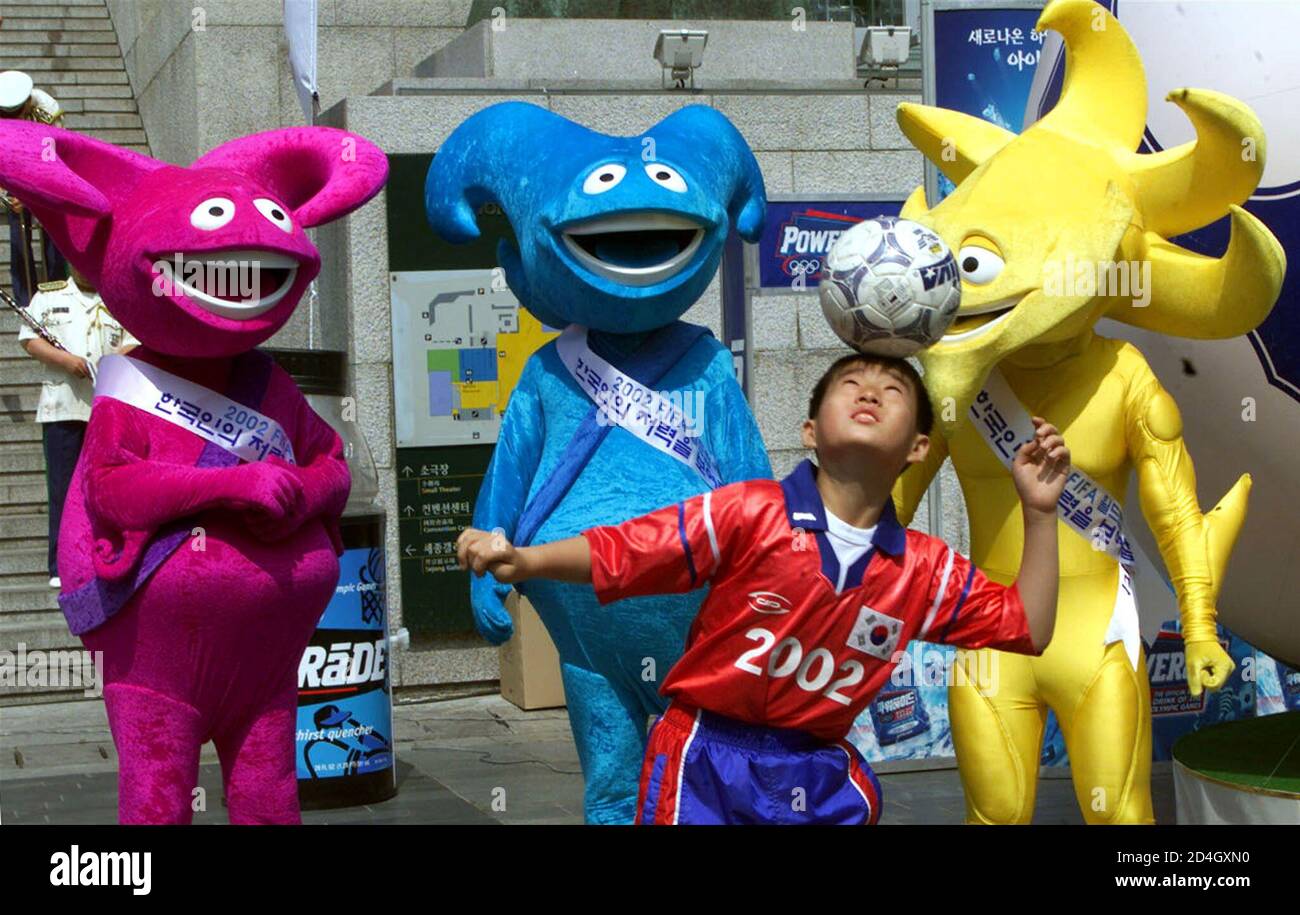 South Korean 11-year-old, Kim Chun-doong, shows his soccer skills as the three official mascots of the 2002 World Cup soccer, (L-R) Nik,Kaz,and Ato look on during a festival to mark the final South Korean 11-year-old, Kim Chun-doong, shows his soccer skills as the three official mascots of the 2002 World Cup soccer, (L-R) Nik,Kaz,and Ato look on during a festival to mark the final