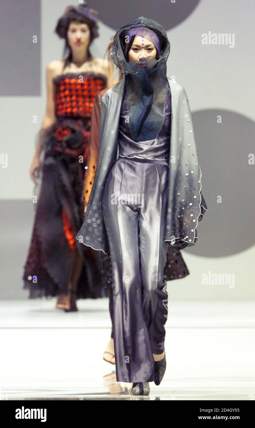 A models present the creaction of Indonesia-Chinese designer Ika at the 'The Pinnacle of the East' show as part of the Hong Kong Fashion Week Spring/Sumer 2002 programme July 12, 2001. A total of 506 exhibitors from 19 countries and regions participate in the event, reflecting a resumption of the industry momentum after recovery from the Asian economic turmoil. Stock Photo