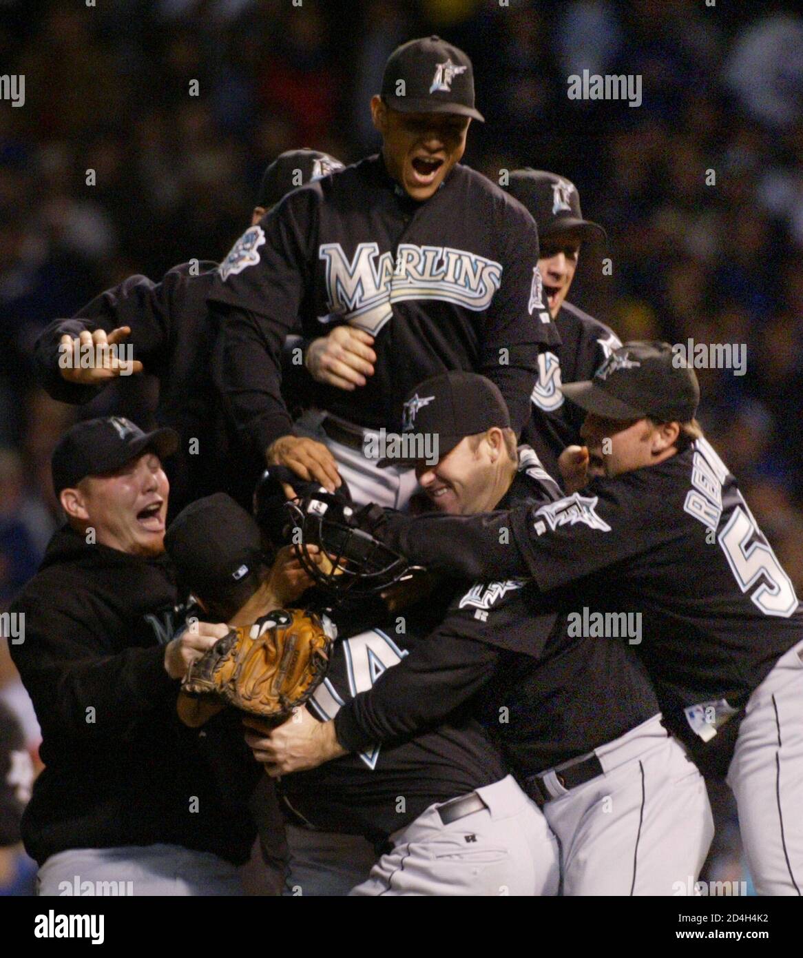 The Florida Marlins celebrate their 9-6 win over the Chicago Cubs in Game 7  of their NLCS Championship series at Wrigley Field in Chicago, October 15,  2003. REUTERS/John Gress JPSII Stock Photo - Alamy