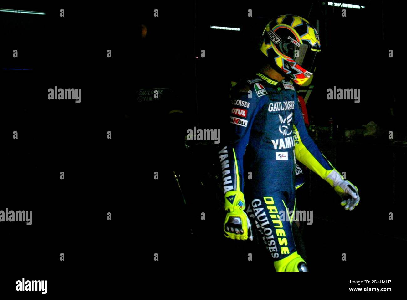 MotoGP rider Rossi walks to his Yamaha during first free practice at  Catalan Motorcycle Grand Prix near Barcelona. MotoGP rider Valentino Rossi  "Il Doctor" of Italy walks to his Yamaha from the