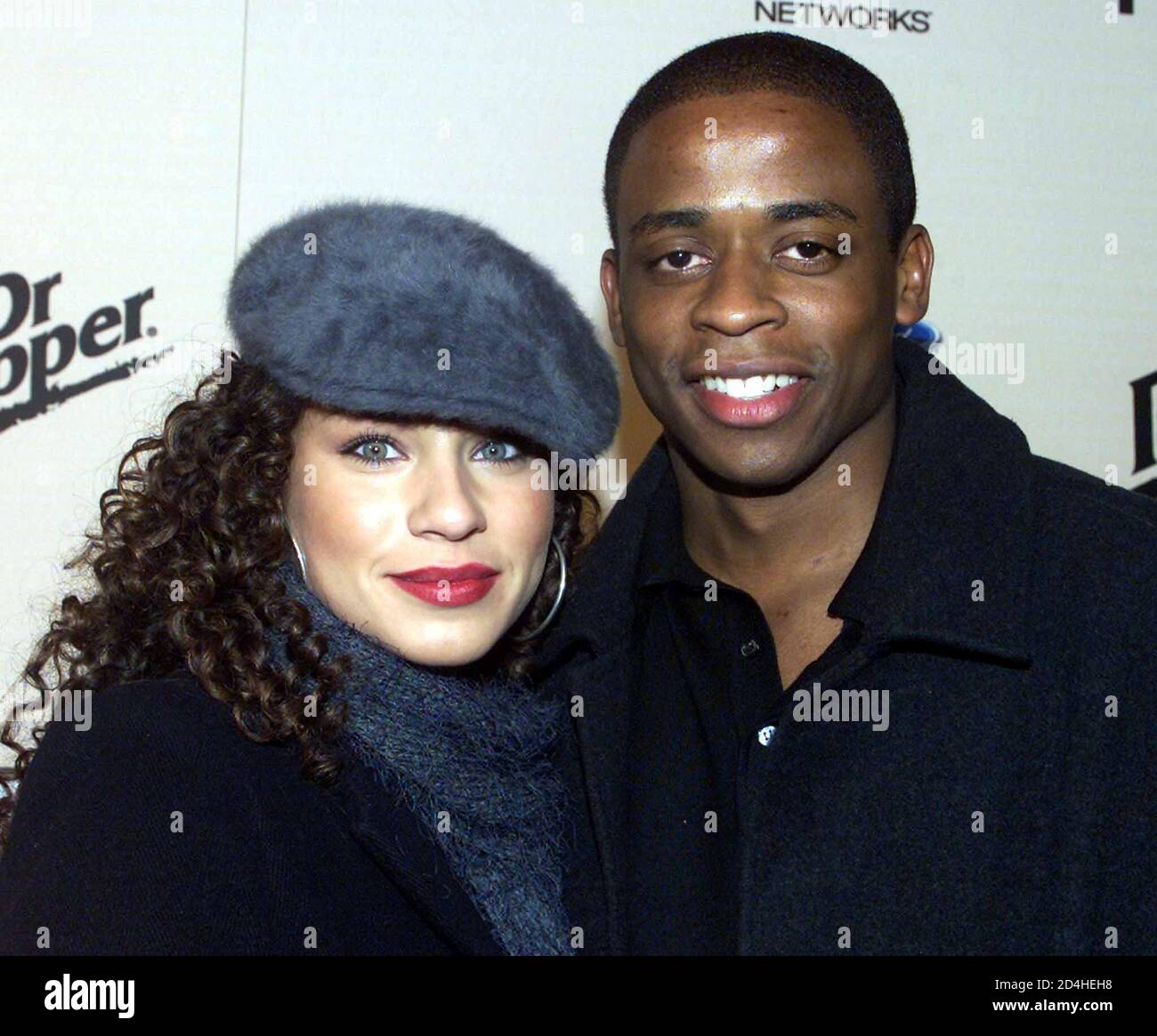Actor Dule Hill and girlfreind actress Nicole Lyn pose as they arrive as  guests at the E! Online Sizzlin' 16 party, January 30, 2002 in Hollywood. [The party honored 16 'twenty-something' actors who are deemed rising stars in Hollywood. Hill is featured in the drama television series 'The West Wing.'] Stock Photo